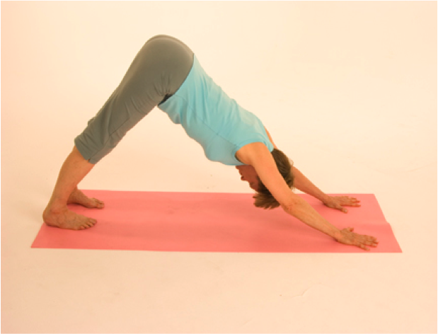 Person practicing downward dog yoga pose