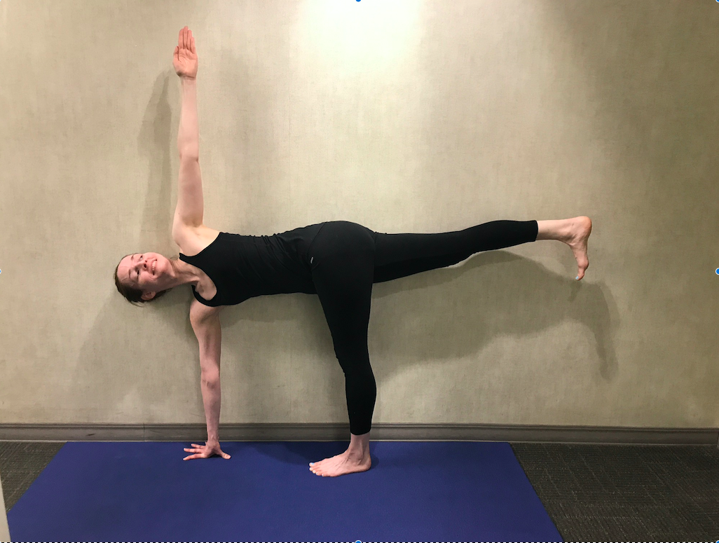 Person doing yoga on blue mat