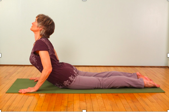 Yoga exercise on green mat