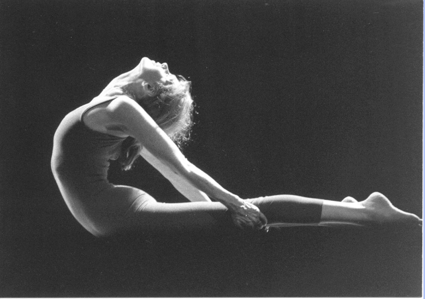 Woman in leotard performing onstage