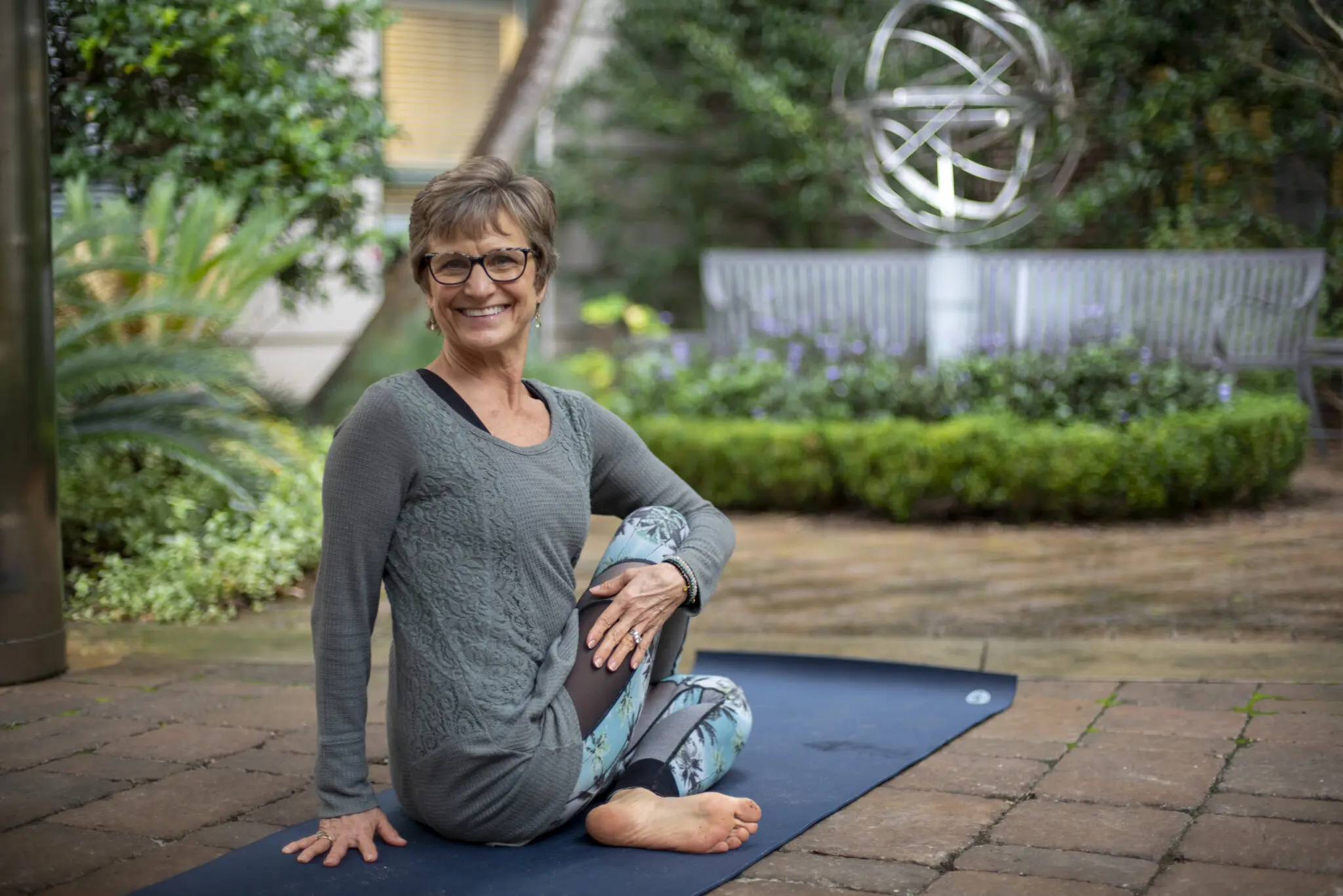 Smiling woman on yoga mat