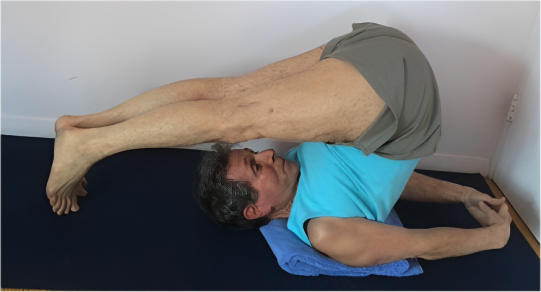 Person doing yoga on a mat