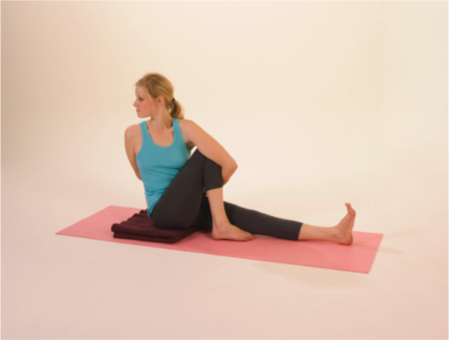 Woman practicing seated yoga pose