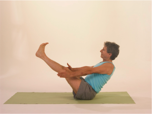 Person in boat pose exercise