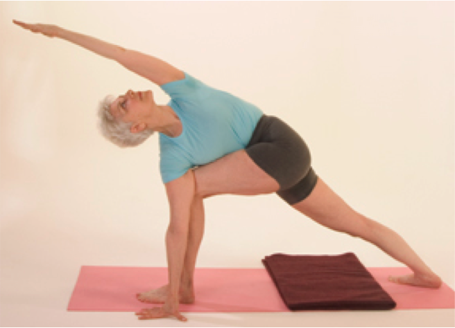 Senior woman in yoga stretch pose