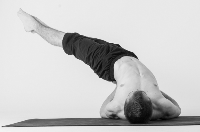 Yoga enthusiast in shoulder stand position