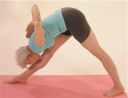 Elderly person doing forward bend stretch