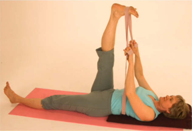 Lying yoga stretch with raised leg