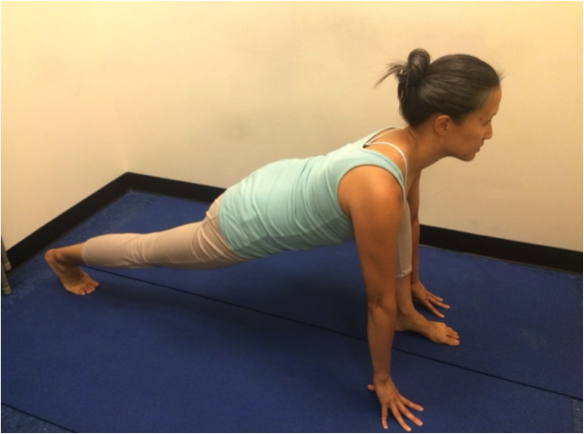 Stretching exercise in a yoga studio.