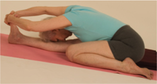 Senior doing seated yoga stretch