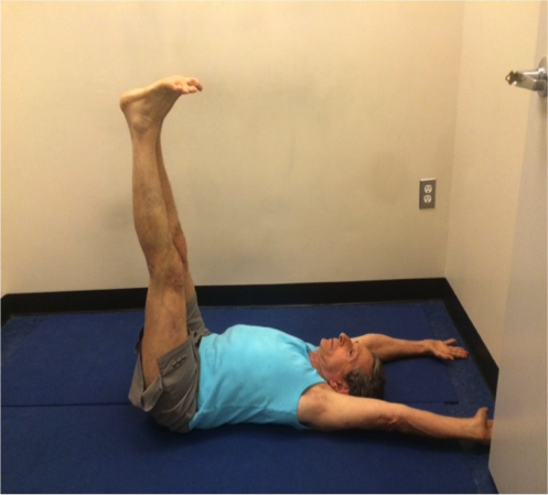 Person doing leg exercise indoors