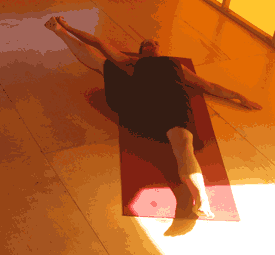 Person stretching on yoga mat