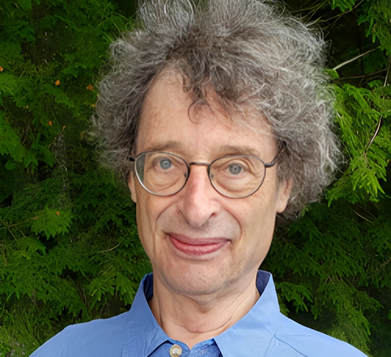 Man with glasses and curly hair