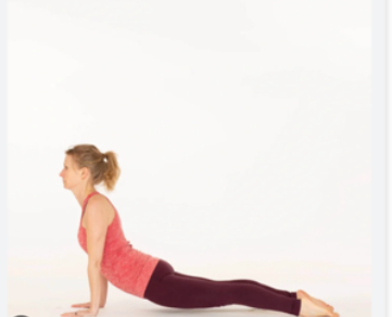 Woman doing upward-facing dog yoga pose