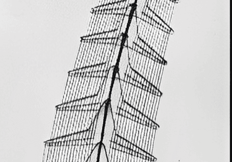 Curved metal tower with repeating fins
