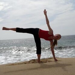 Balancing yoga pose near waves
