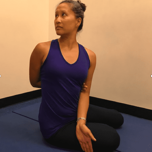 Woman practicing seated yoga pose