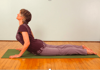 Yoga exercise on green mat