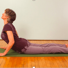 Yoga exercise on green mat