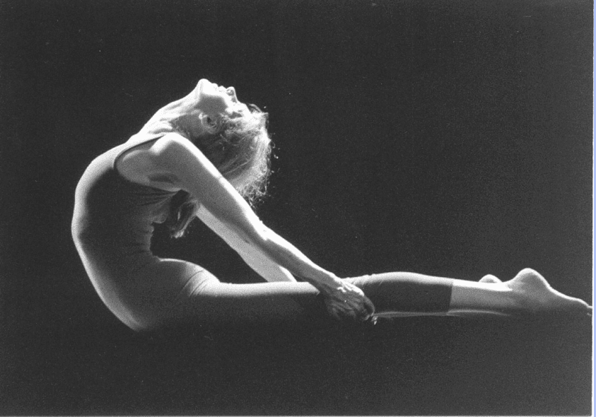 Woman in leotard performing onstage