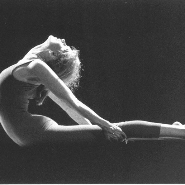 Woman in leotard performing onstage