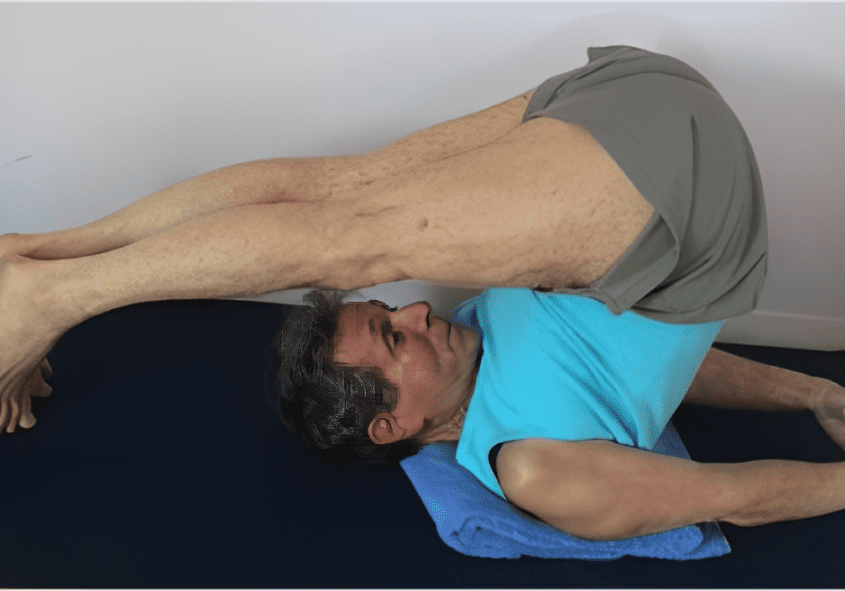 Person doing yoga on a mat