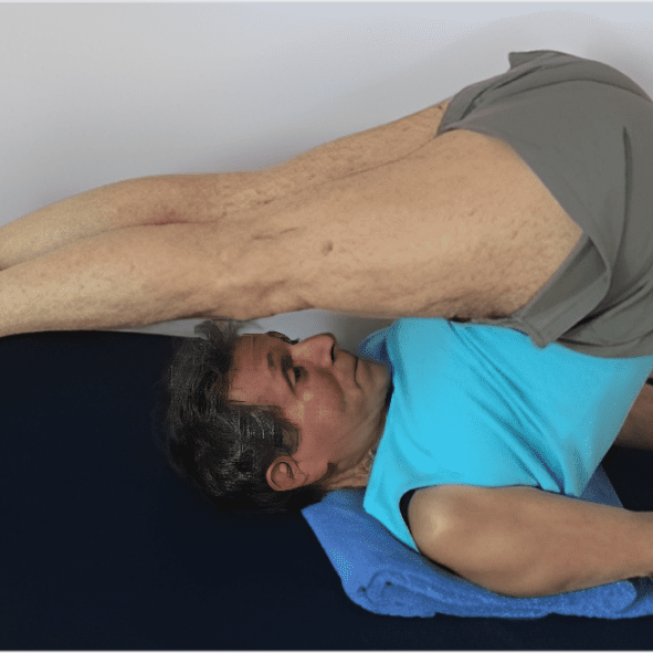 Person doing yoga on a mat