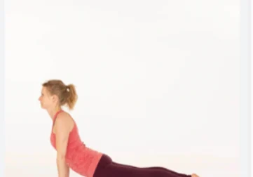 Woman doing upward-facing dog yoga pose