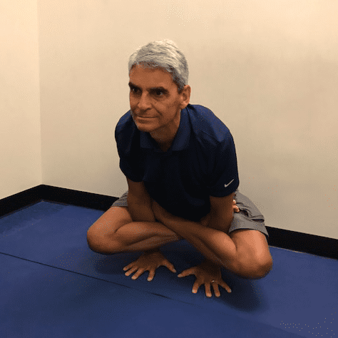Individual performing a seated yoga position.