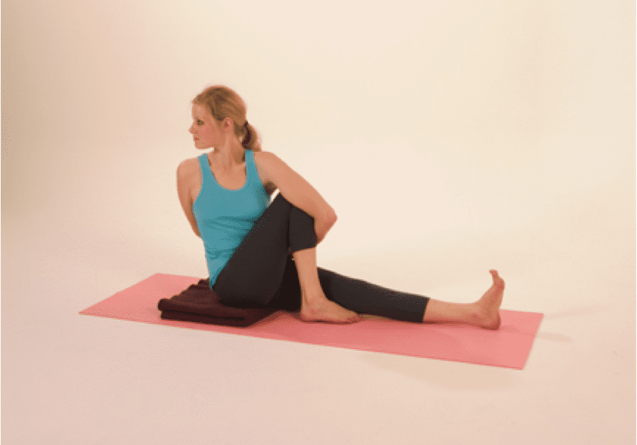 Woman practicing seated yoga pose