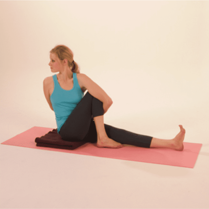 Woman practicing seated yoga pose