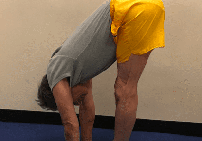 Man doing forward bend yoga pose