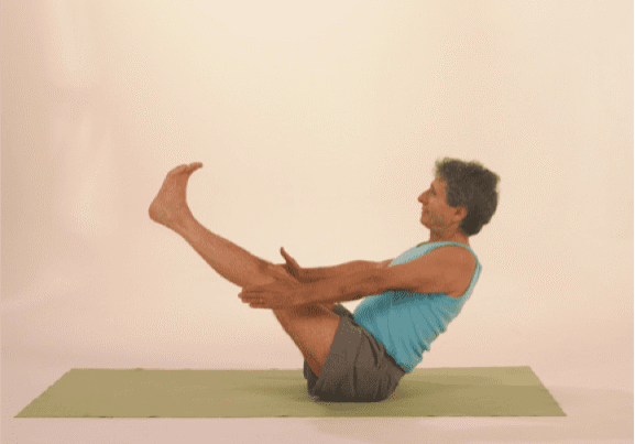 Person in boat pose exercise