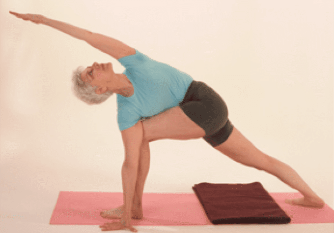 Senior woman in yoga stretch pose