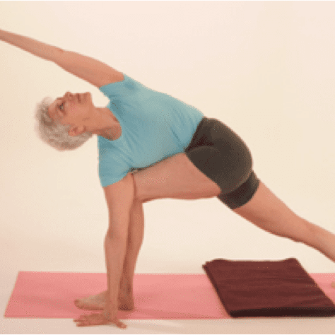 Senior woman in yoga stretch pose