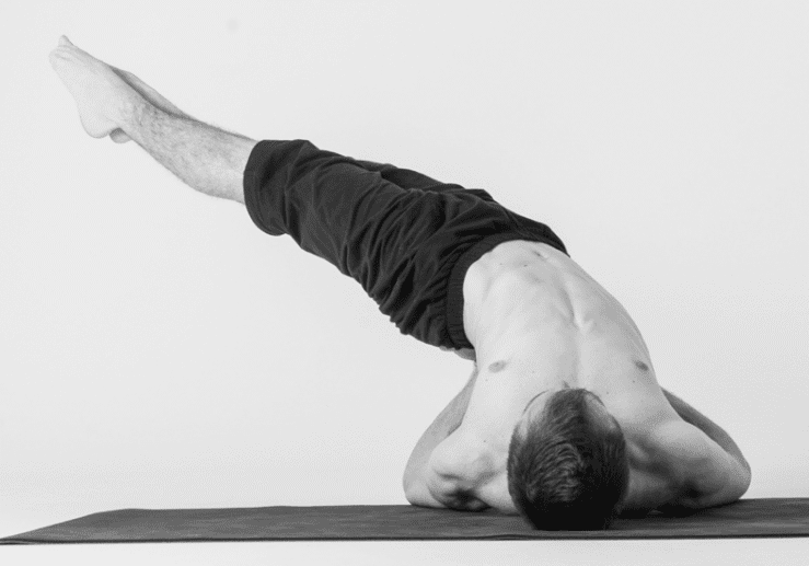 Yoga enthusiast in shoulder stand position
