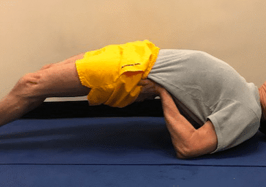 Man doing yoga bridge pose