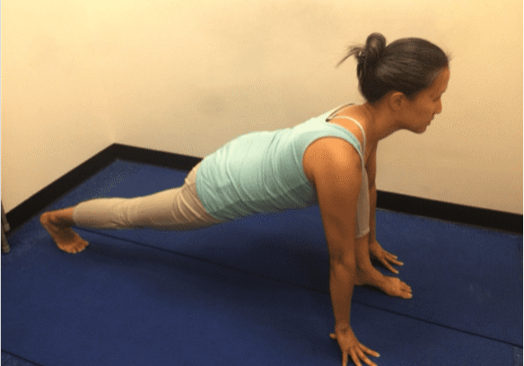 Stretching exercise in a yoga studio.