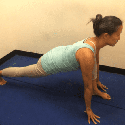 Stretching exercise in a yoga studio.