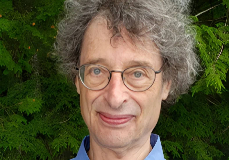 Man with glasses and curly hair