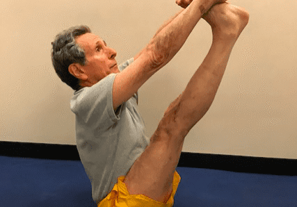 Man practicing seated yoga pose