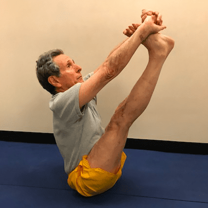 Man practicing seated yoga pose