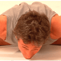 Person practicing flexibility exercise on floor