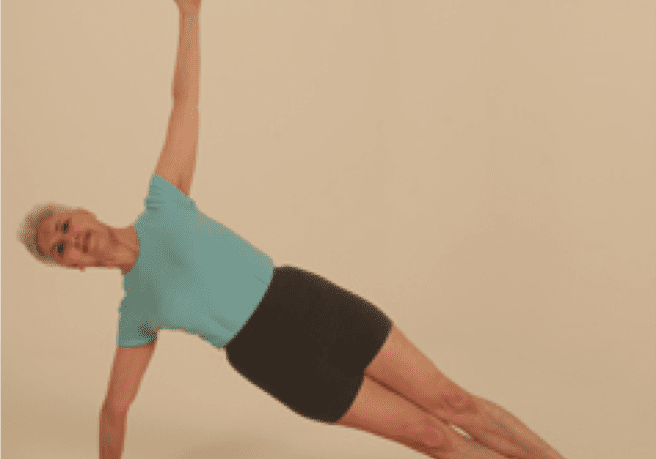 Person practicing side plank yoga pose