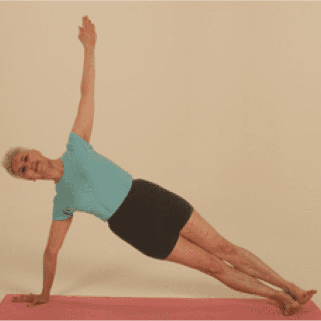 Person practicing side plank yoga pose