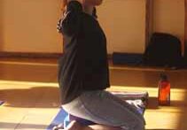 Person practicing yoga indoors on mat