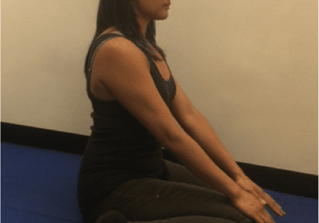 Woman practicing seated yoga pose